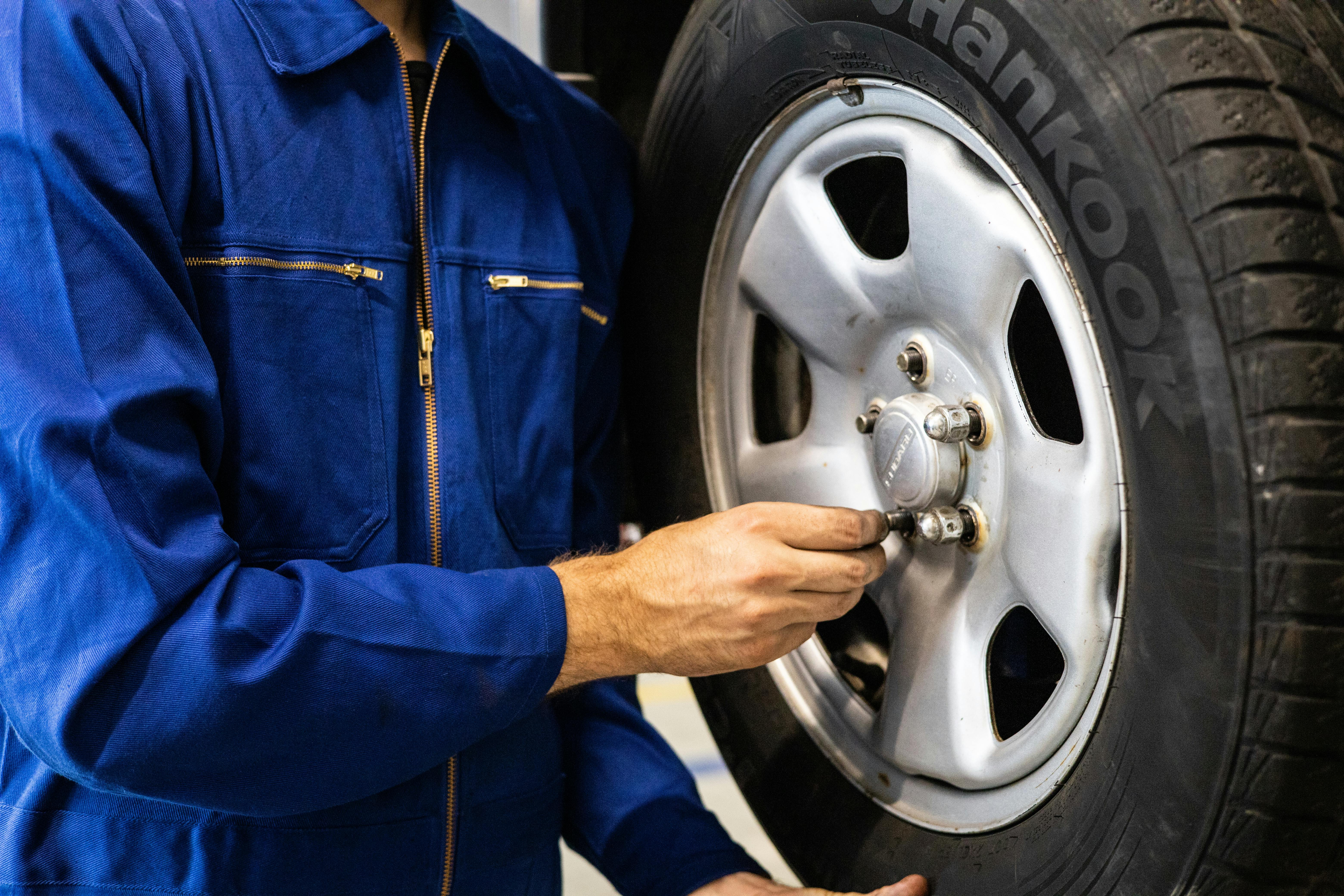 MOT history check before buying used car - wheel inspection at UK garage
