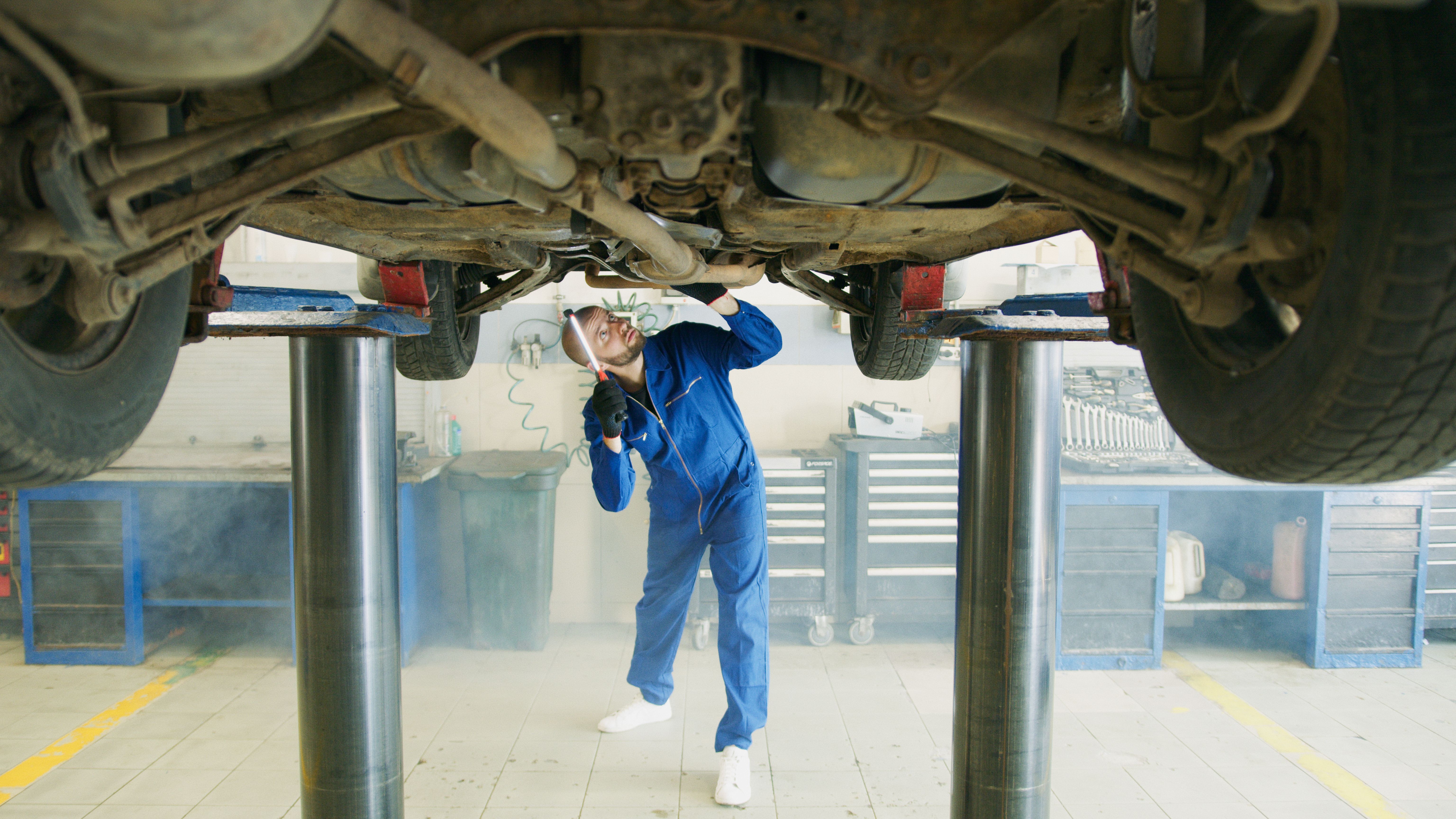 Vehicle inspection - MOT underside check at UK test centre